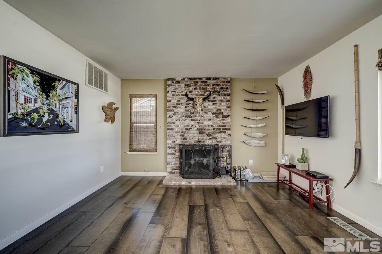 3812 Bexley Square Reno, NV 89503 - Photo 6 of 16 a living room with furniture fireplace and flat screen tv