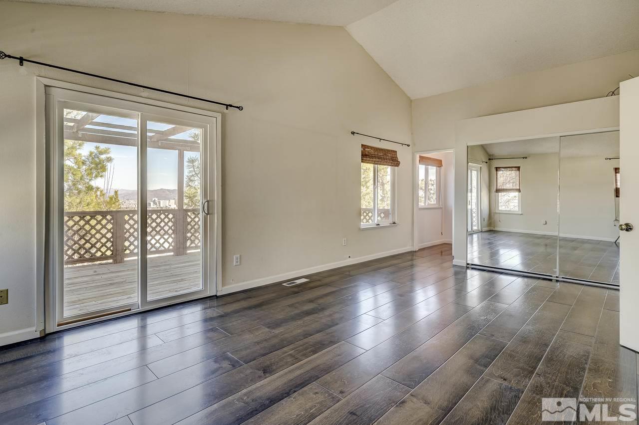 3812 Bexley Square Reno, NV 89503 - Photo 8 of 16 an empty room with wooden floor and windows