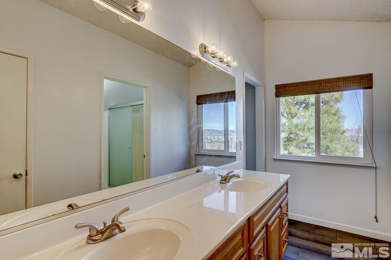 3812 Bexley Square Reno, NV 89503 - Photo 9 of 16 a bathroom with a double vanity sink and a mirror