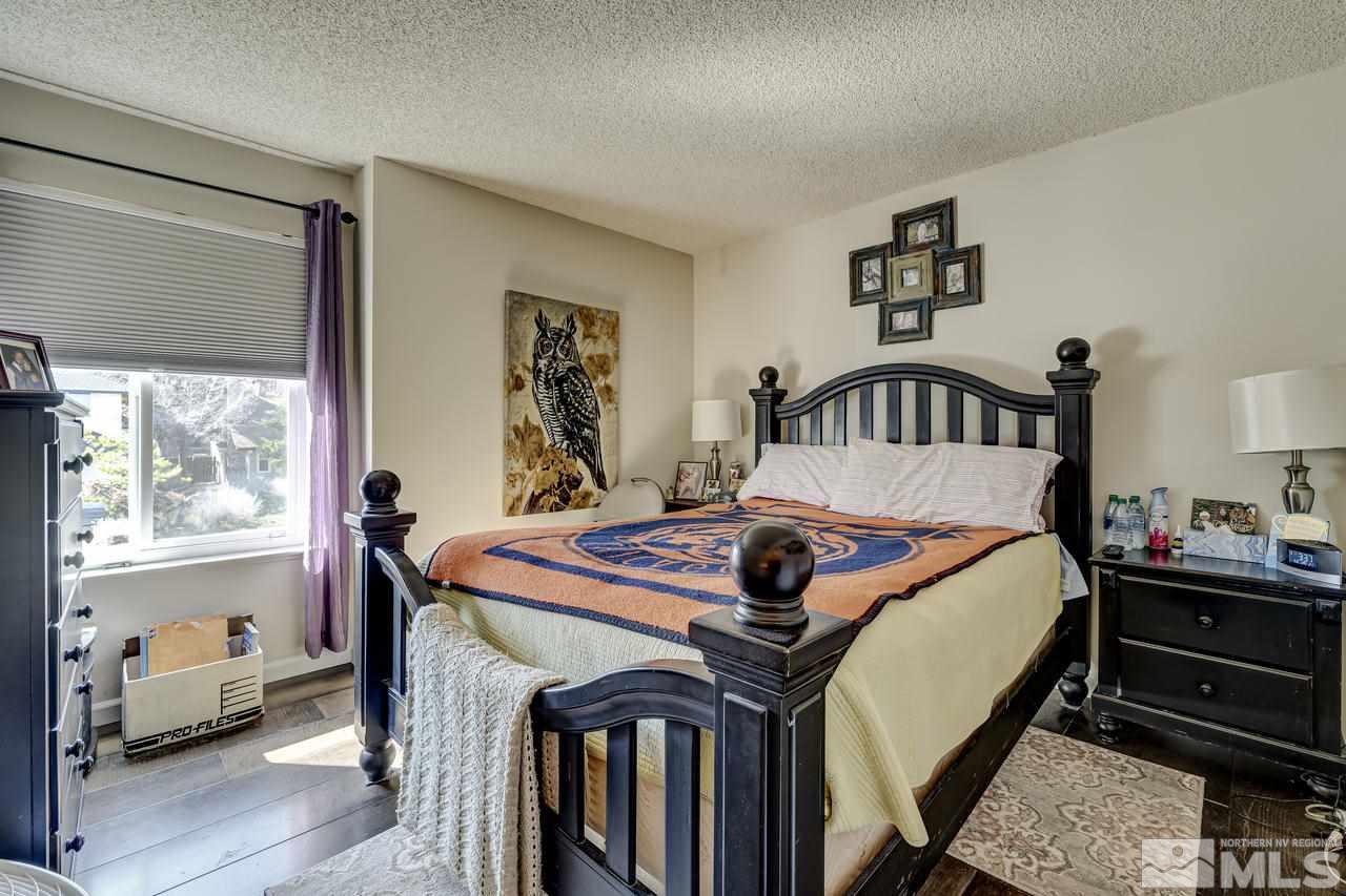 3812 Bexley Square Reno, NV 89503 - Photo 10 of 16 a bed room with a bed and a table