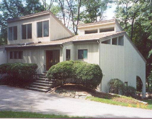 32 Mill Brook Road Stamford, CT 06902 - Photo 1 of 1 a view of a white house next to a yard