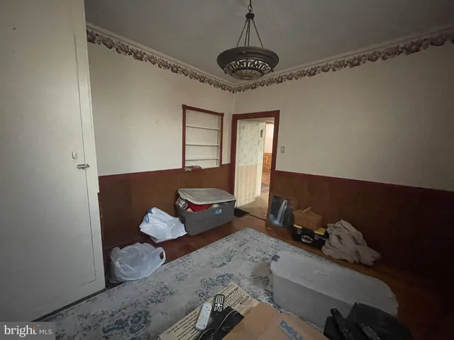 a living room with furniture flowerpot and a window