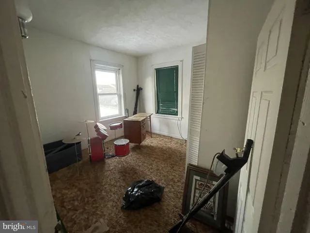 a bed room with furniture and a window