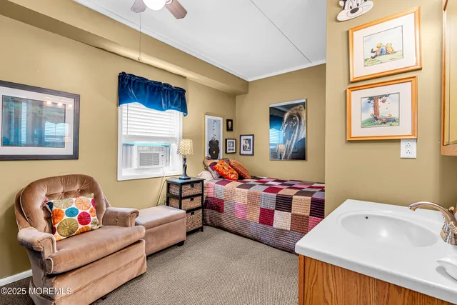 a bedroom with a bed and a couch