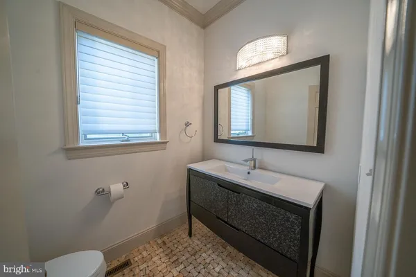 a kitchen with sink cabinets and window