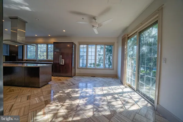 a kitchen with a sink and a refrigerator