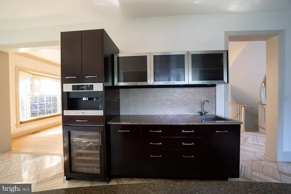 a kitchen with a refrigerator stove and cabinets