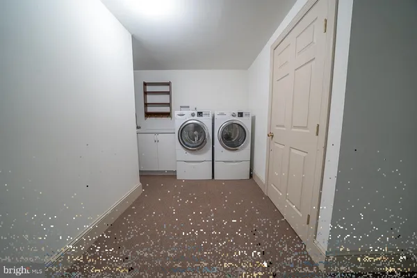 a view of an empty room with a garage