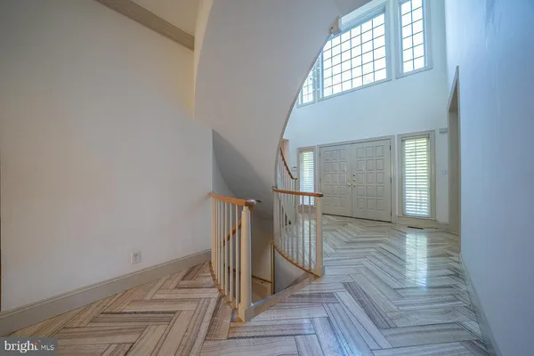 a room with furniture a flat screen tv and a window