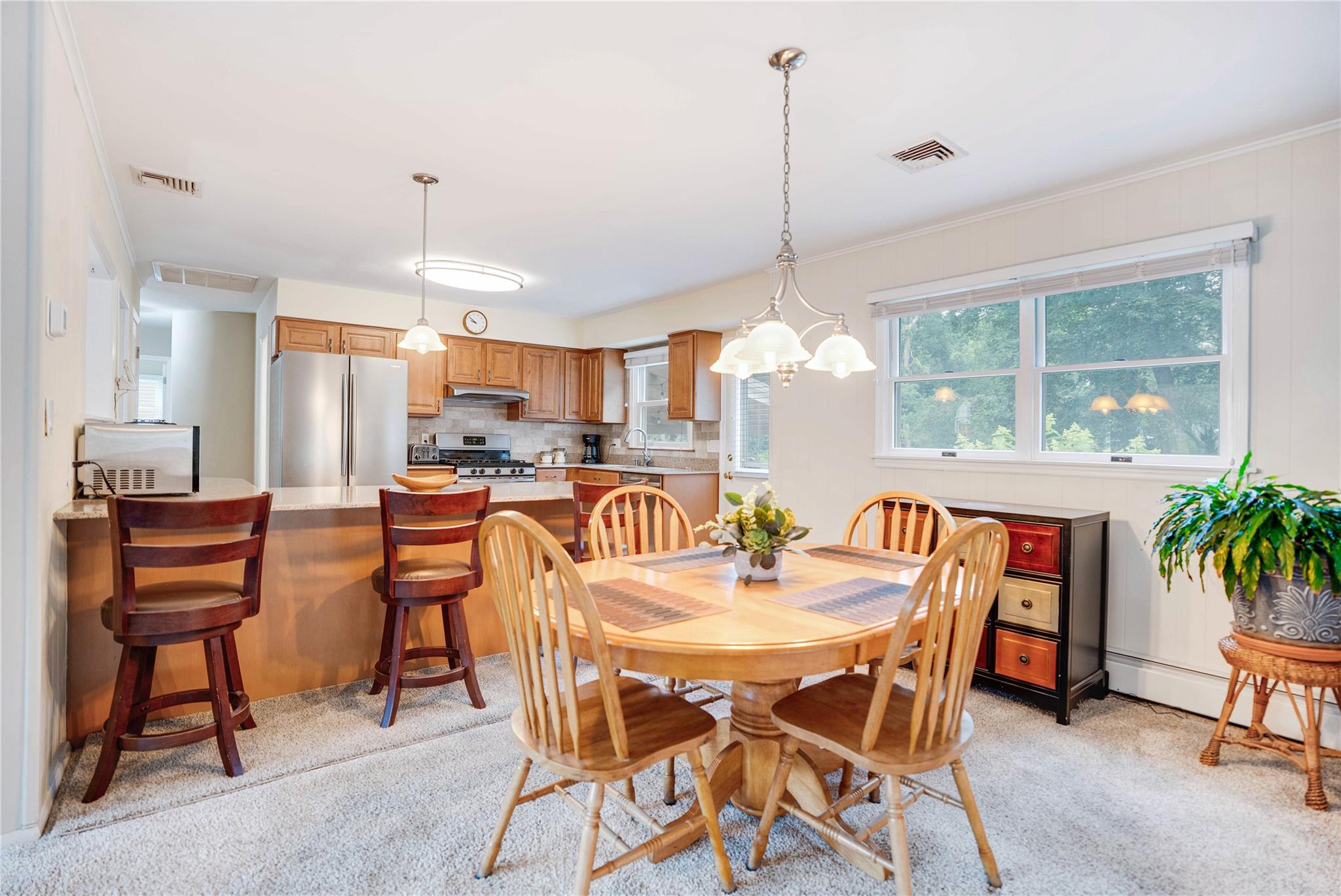 7 Russell Road Hampton Bays, NY 11946 - Photo 11 of 31 Dining space with light colored carpet
