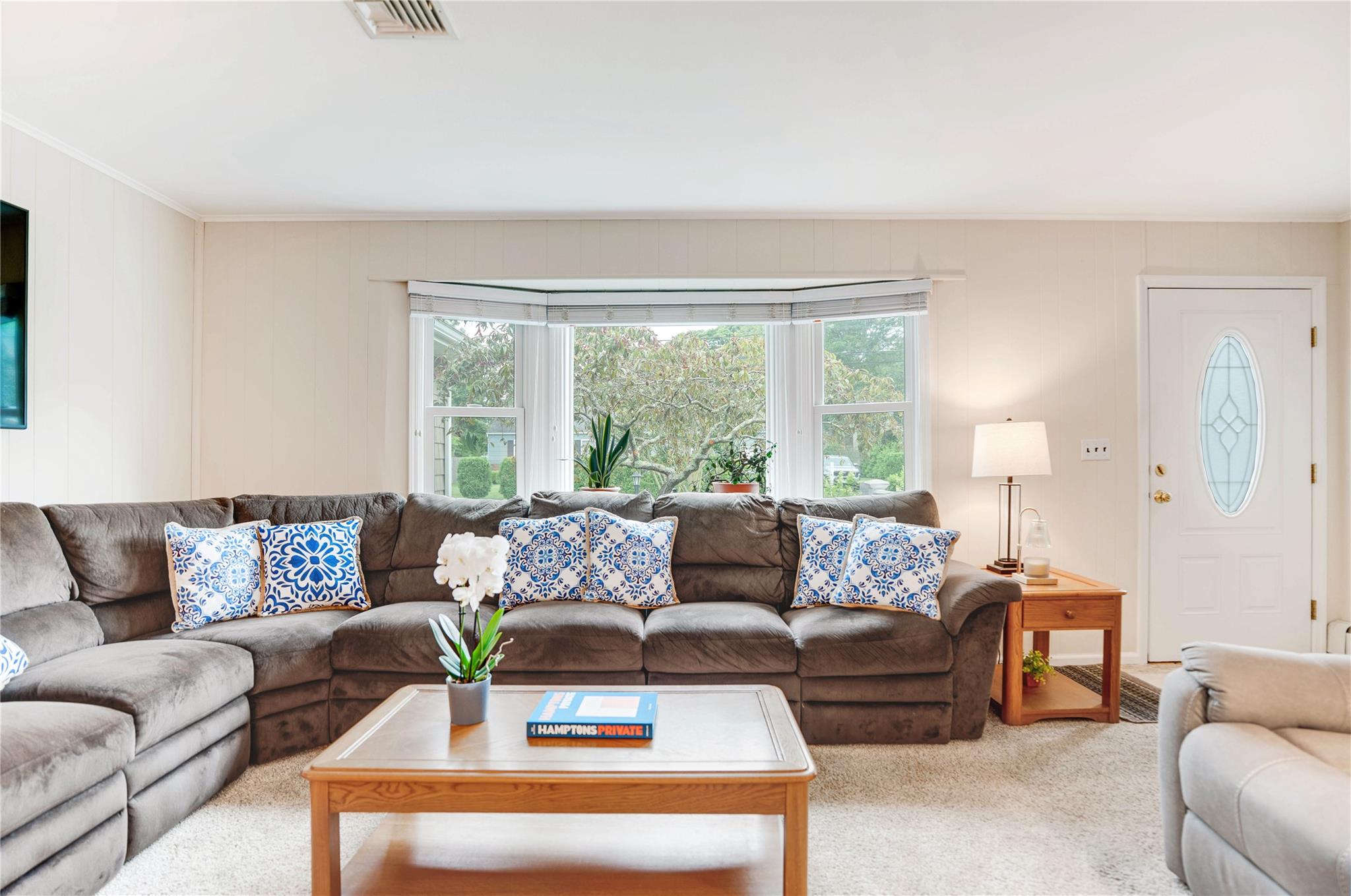 7 Russell Road Hampton Bays, NY 11946 - Photo 31 of 31 Living area with carpet and ornamental molding