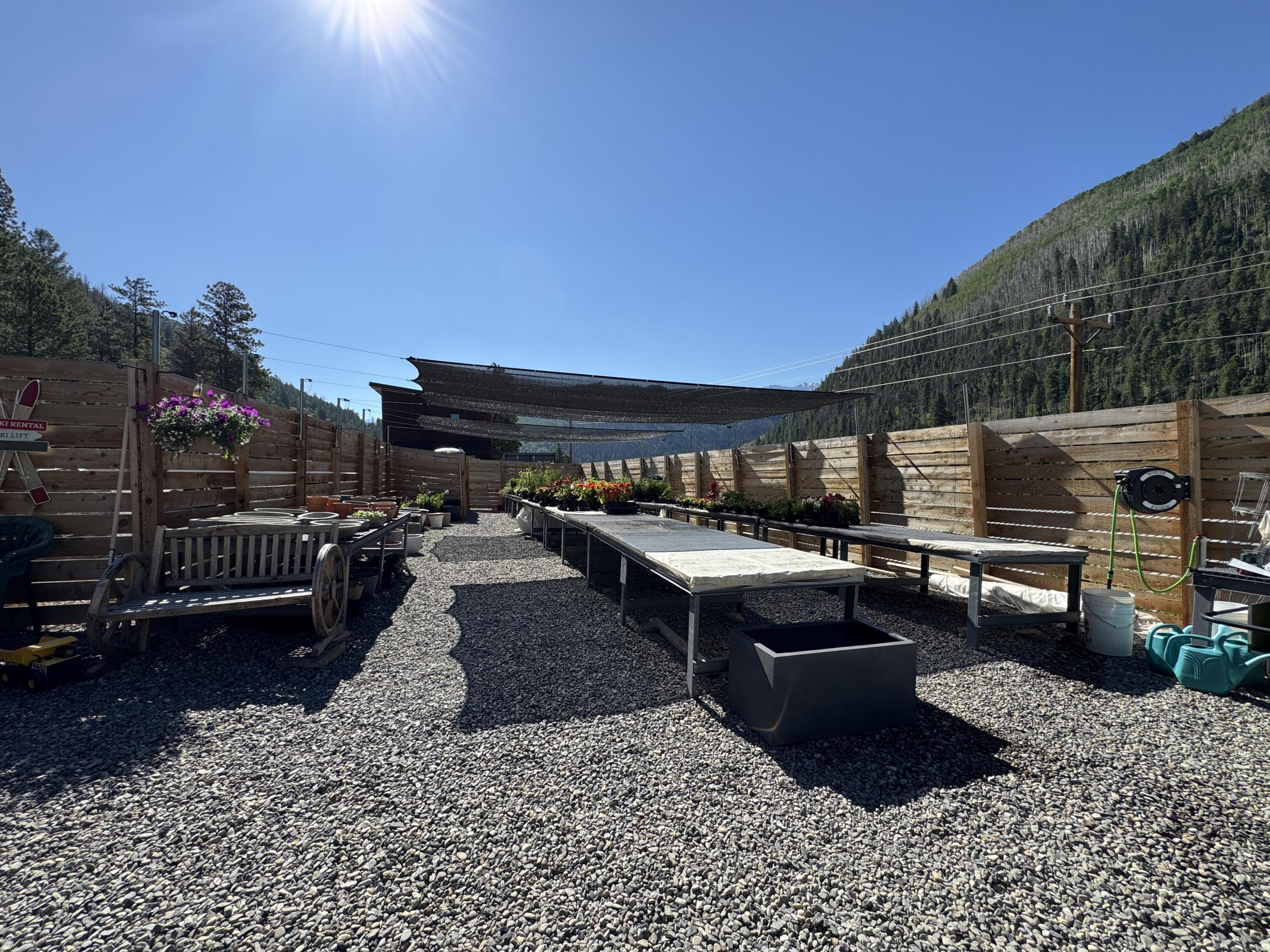717 South South Park Road Telluride, CO 81435 - Photo 7 of 27 a view of a patio with a table chairs and a fire pit