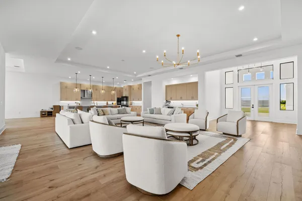a spacious bathroom with a double vanity sink a mirror and a bathtub