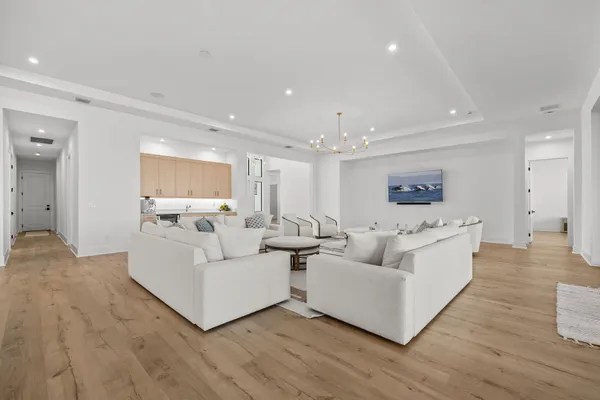 a large bathroom with a double vanity sink a large mirror and a shower