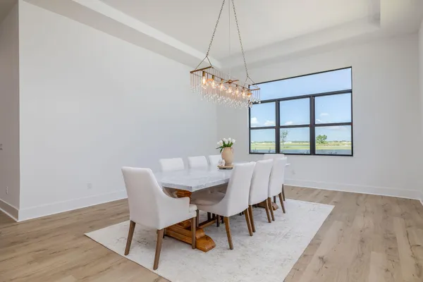 a bedroom with a bed and a potted plant