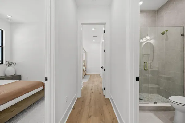 a bedroom with a bed and a lamp