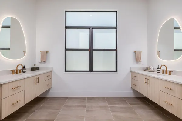 a bathroom with a granite countertop sink a toilet and a shower