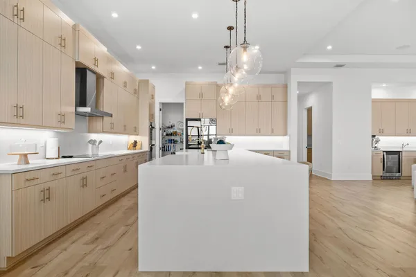 a spacious bedroom with a bed and a large window