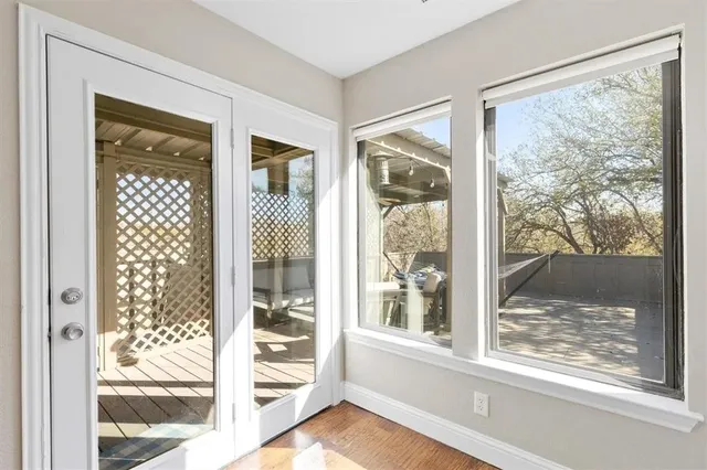 a view of a room that has a large window