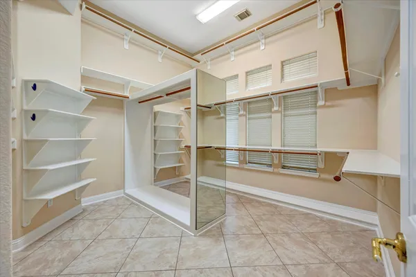 a spacious bathroom with a tub and shower