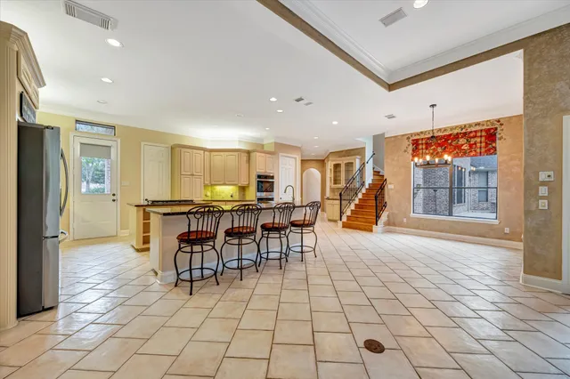 a view of a dining hall with lots of tables and chairs
