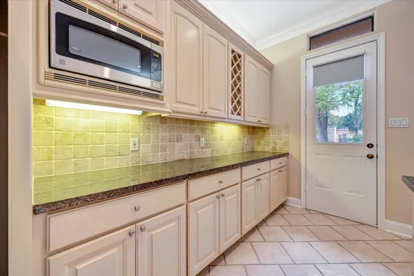 a bathroom with a sink a mirror and shower