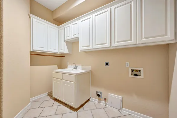 a utility room with cabinets