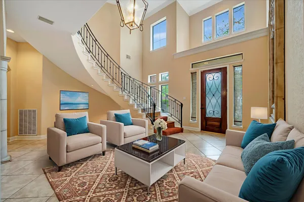 a living room with furniture or couch and a dining table