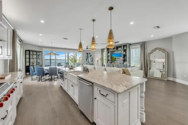 a kitchen with appliances cabinets and furniture