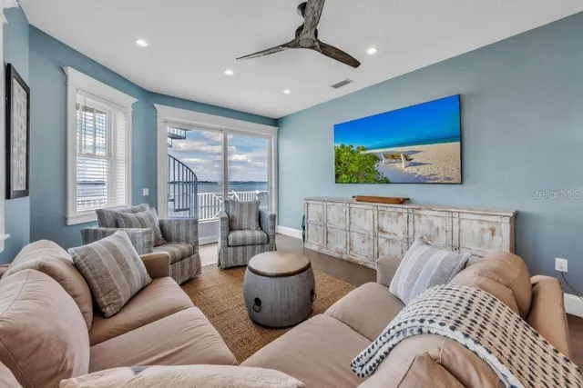 a kitchen with stainless steel appliances granite countertop a sink a stove and a wooden floors