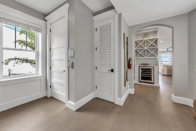 a spacious bathroom with a granite countertop sink and a mirror