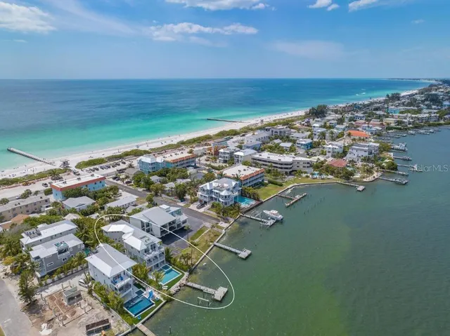 a view of a chairs and table in patio