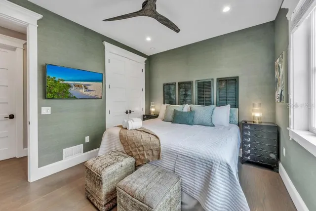 a bedroom with a bed and a window