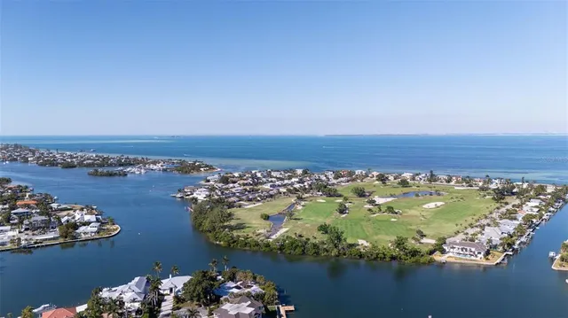 a view of a lake with a yard