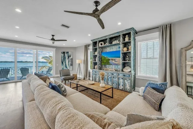 a kitchen with stainless steel appliances granite countertop sink stove and wooden floor