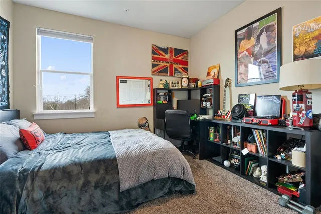 a bed room with a bed and a window