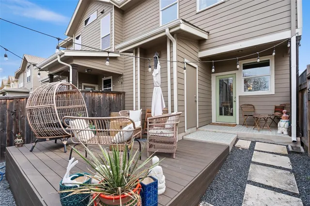 a view of a patio with couches chairs and potted plants
