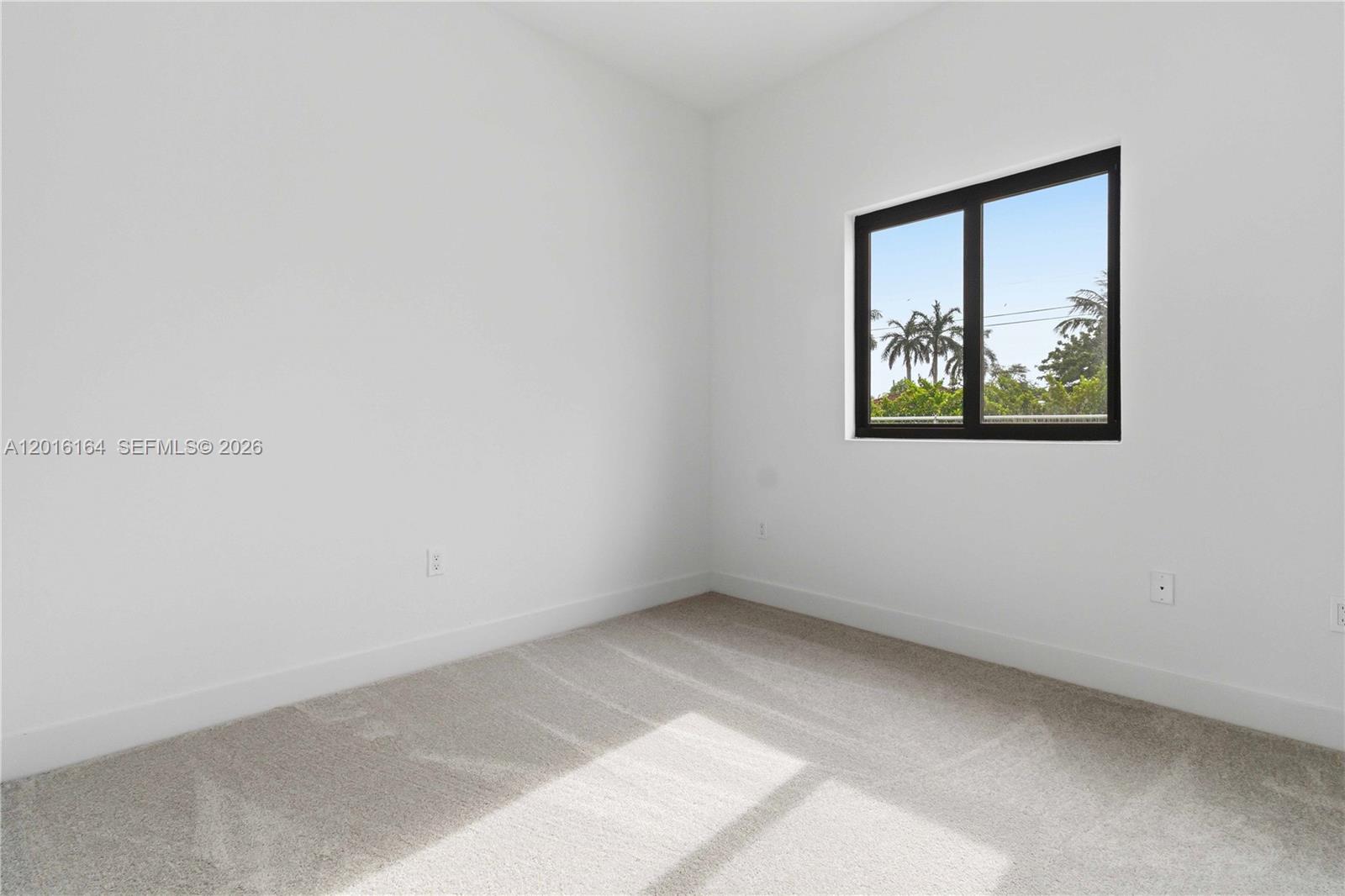 18901 Southwest 316th Street Homestead, FL 33030 - Photo 19 of 33 an empty room with windows