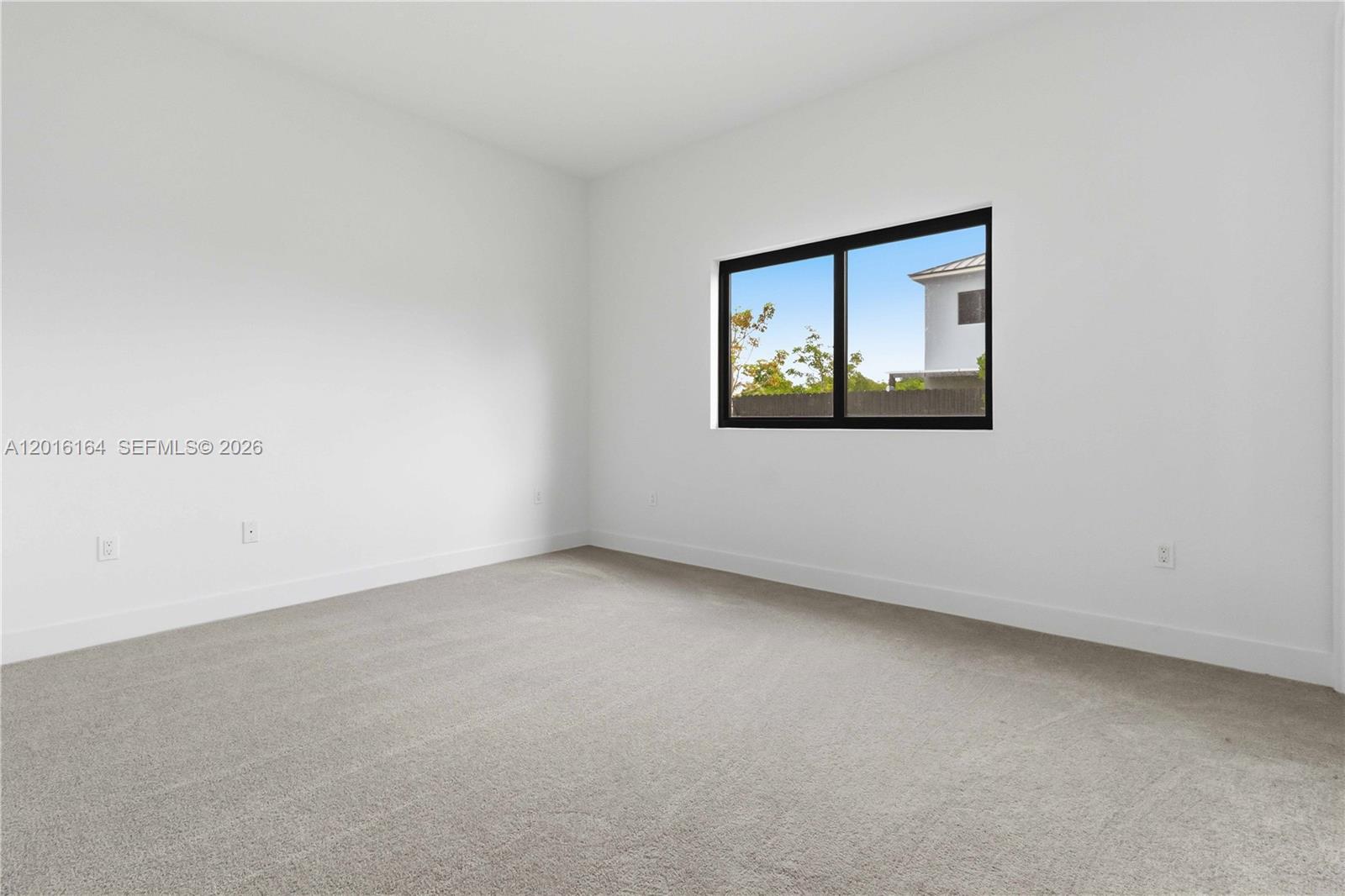 18901 Southwest 316th Street Homestead, FL 33030 - Photo 21 of 33 an empty room with a window