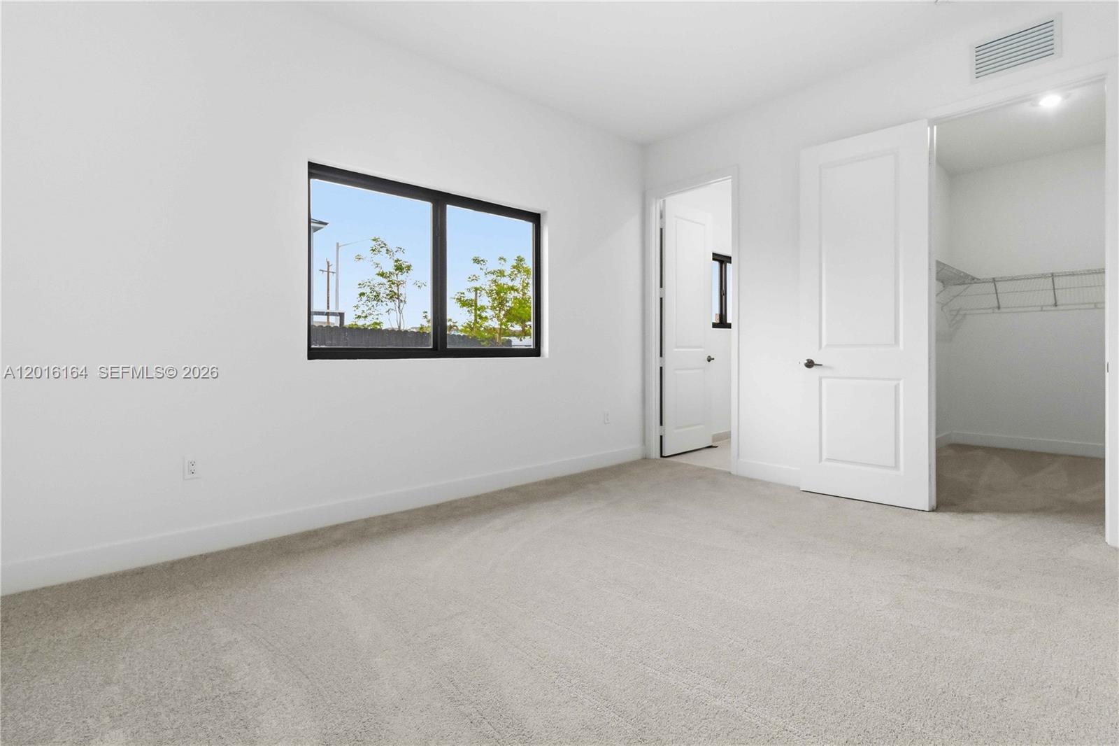 18901 Southwest 316th Street Homestead, FL 33030 - Photo 23 of 33 an empty room with windows