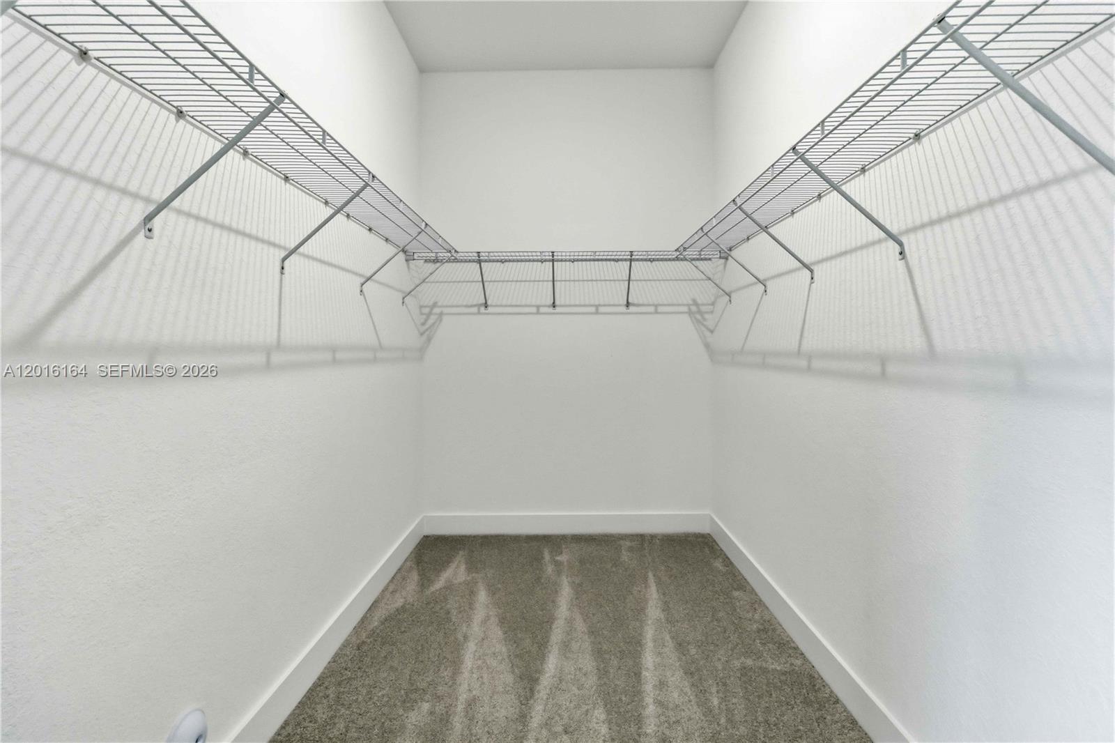18901 Southwest 316th Street Homestead, FL 33030 - Photo 25 of 33 a view of a room with racks on the wall