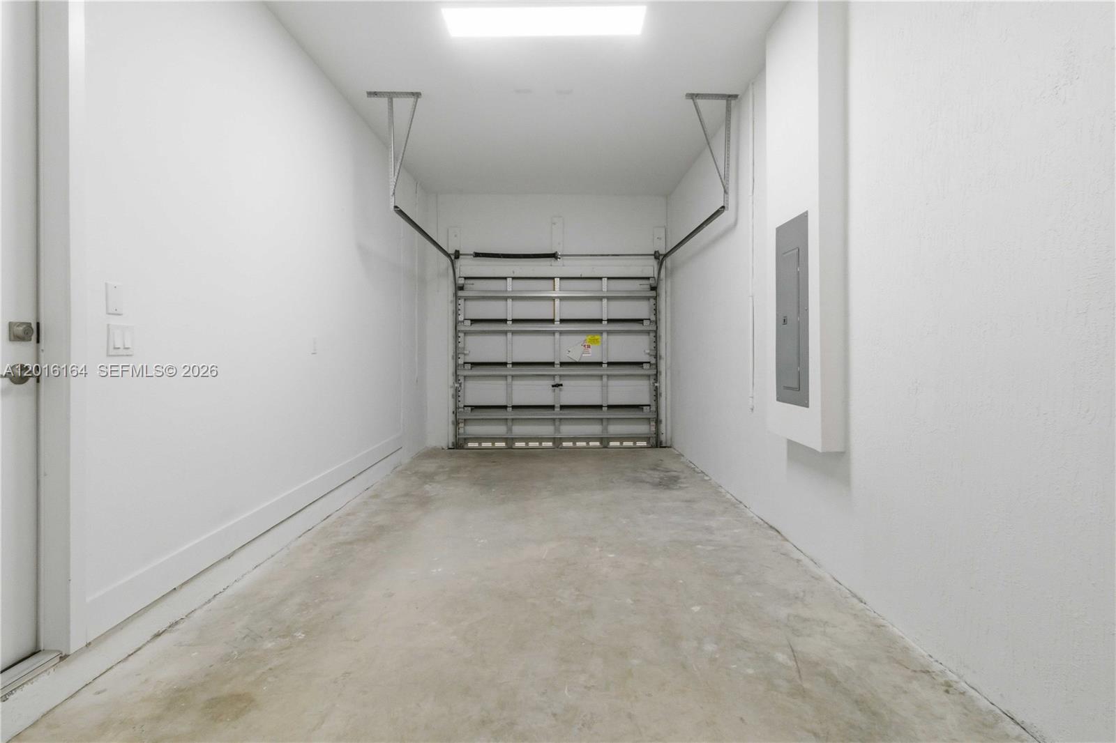 18901 Southwest 316th Street Homestead, FL 33030 - Photo 30 of 33 a view of a room with stairs and a closet