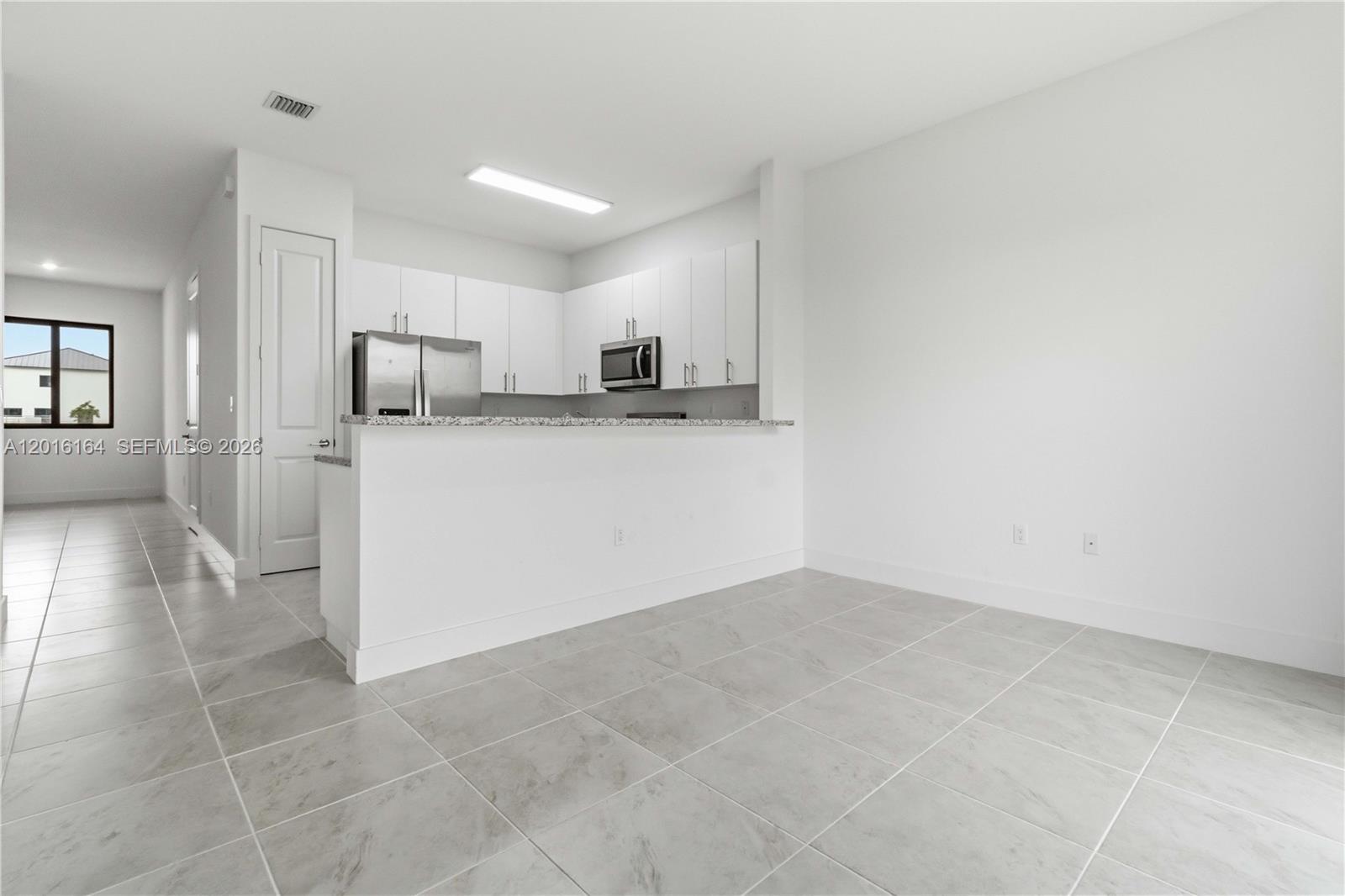 18901 Southwest 316th Street Homestead, FL 33030 - Photo 10 of 33 a view of a kitchen with a sink