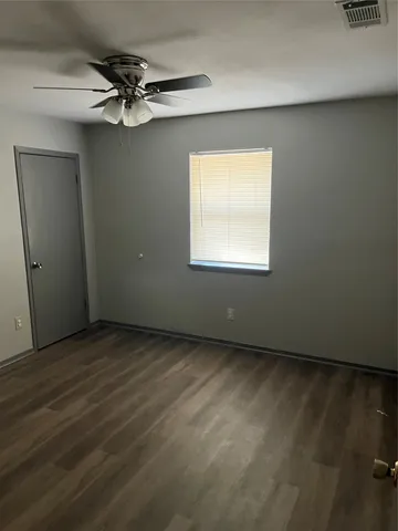 a view of a room & wooden floor