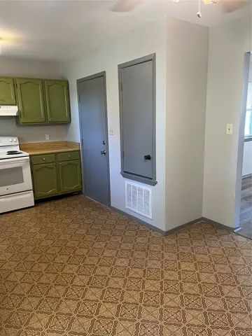 a view of a room with a bathtub and a window