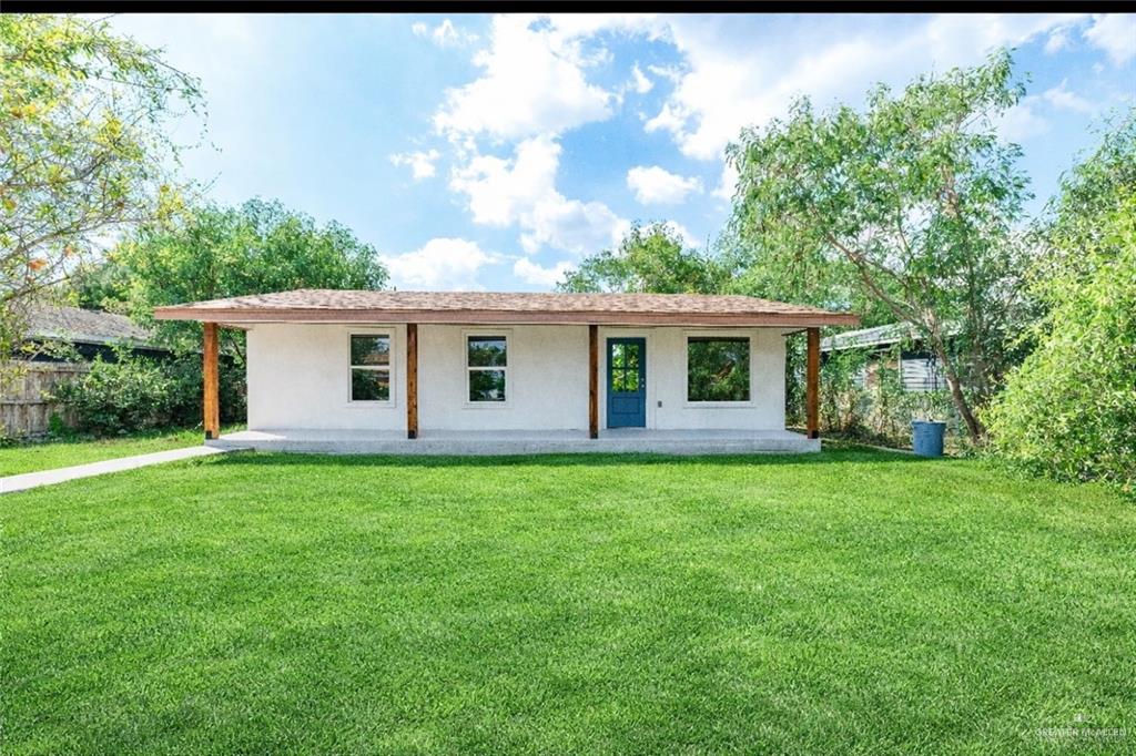 214 South 28th Street McAllen, TX 78501 - Photo 1 of 9 a view of a house and a yard with green space