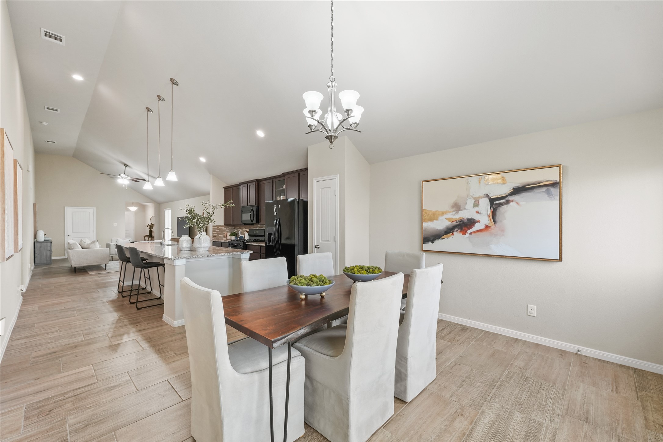 7911 Tuscan Cypress Drive Cypress, TX 77433 - Photo 11 of 27 a view of a dining room with furniture and a chandelier