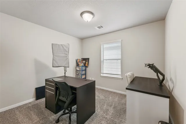 a room with furniture and a window