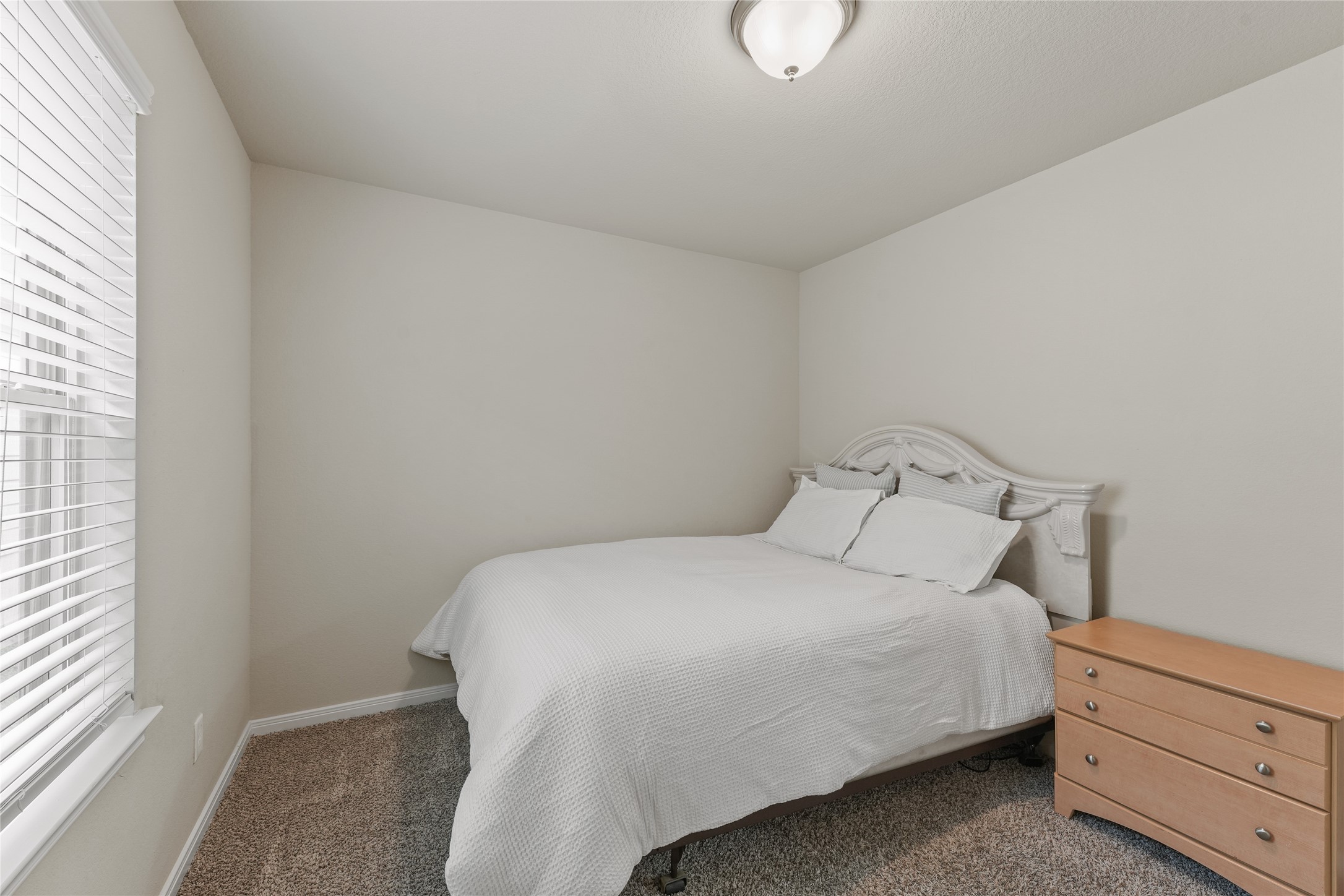 7911 Tuscan Cypress Drive Cypress, TX 77433 - Photo 19 of 27 a bedroom with a bed and window