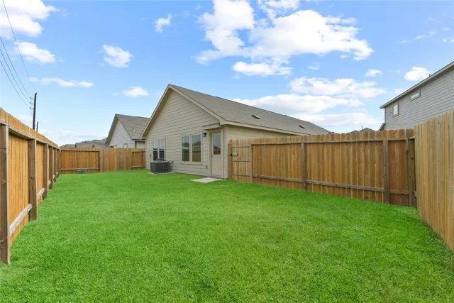 a view of a backyard with plants and a garden
